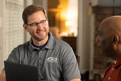 JES inspector meeting with a homeowner