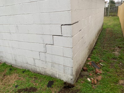 cracking and settling building corner due to settlement and expansive soil