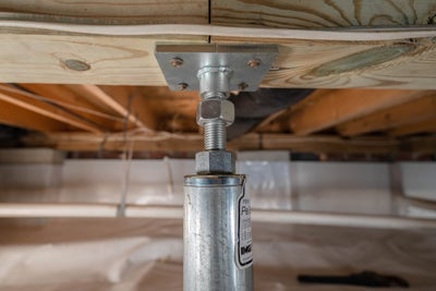 closeup of a crawl space jack