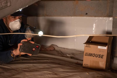 Foundation Recovery Systems inspector inspecting crawl space
