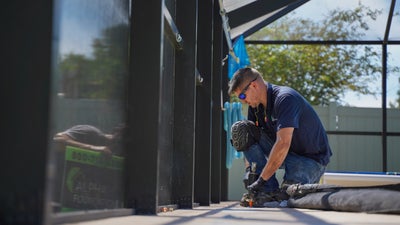 crew member fixing concrete slab