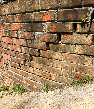 exterior cracks in brick wall