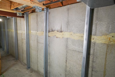 A wall in a basement that repaired with IntelliBrace⢠Wall Repair System