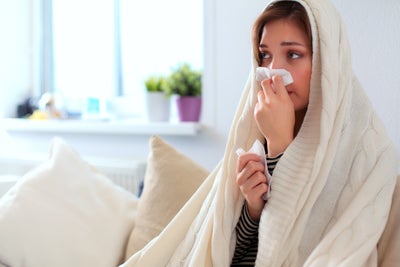 woman sick with the sniffles
