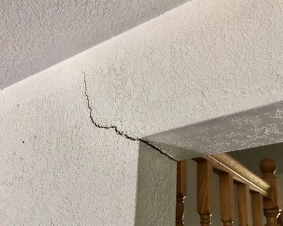 drywall crack near the corner of a doorway