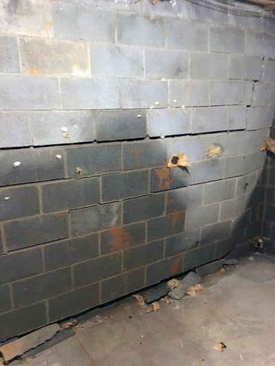 bowing, cracked basement wall