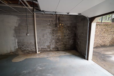 Stained, damp block wall.