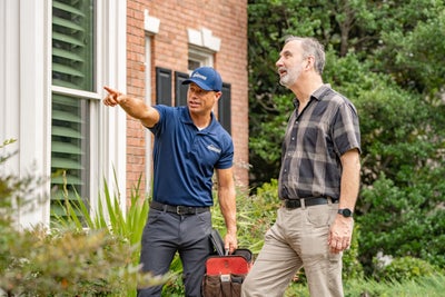 AquaGuard inspector with homeowner
