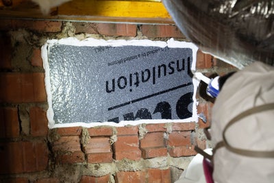 Insulation installed in a crawl space to lower energy bill costs.