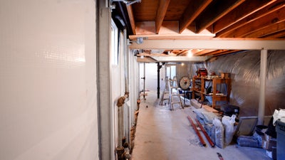 A basement that has not been clear before it gets a waterproofing system installed.