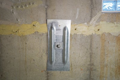 Close up of an installed wall anchor.