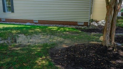 expansive, flooded yard next to house