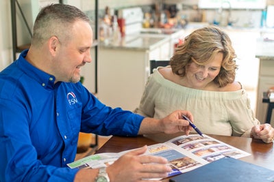 FSM inspector meeting with a homeowner