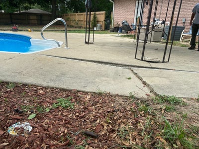 cracking and uneven concrete pool deck