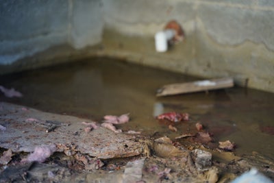 A basement that has pooling water in it due to the home being in a flood-prone area