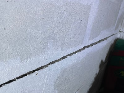Close up of brick that is cracking and wall shearing.