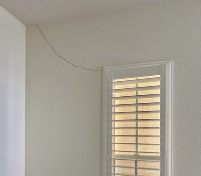 A crack in the drywall of a home.