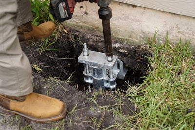 Pier being installed on foundation footing