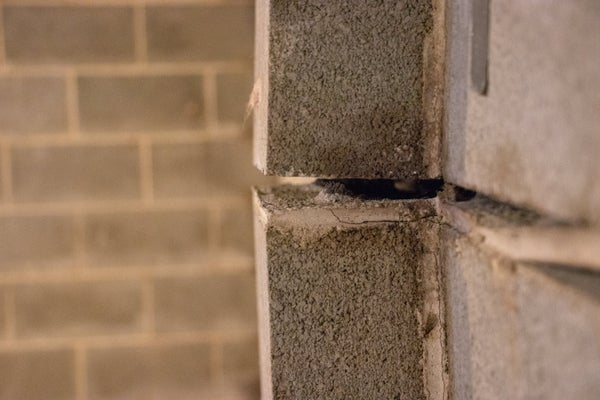 Close up of bad bowing bricks and wall gap