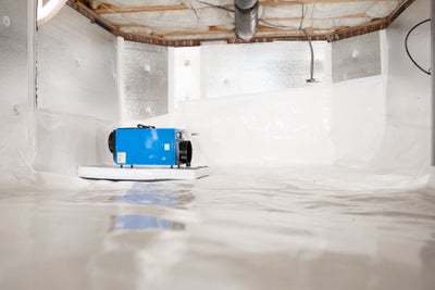 Crawl space encapsulated with a dehumidifier.