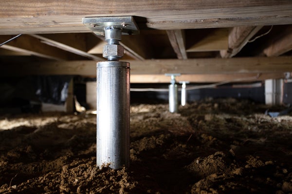 CrawlDrain being installed in crawl space
