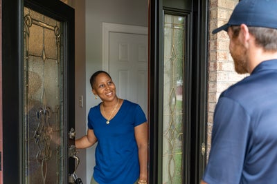 Groundworks employee meeting with homeowner