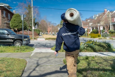 A professional preparing to waterproof a basement to ensure mold growth is prevented.