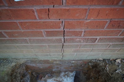 vertical cracks in brick wall