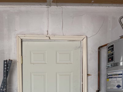 wall cracks around a door