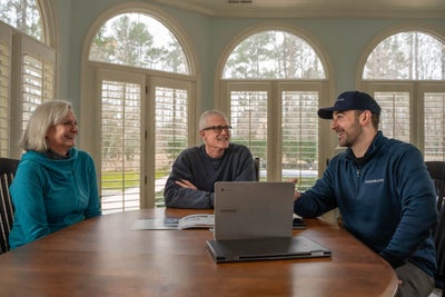 Groundworks inspector talking with homeowners.
