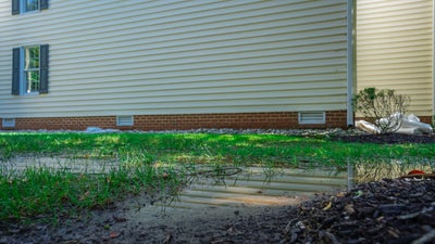 Flooded back yard at a house.