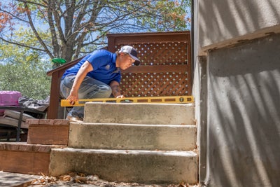 crew measuring concrete steps