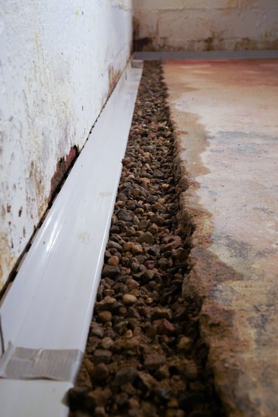 Perimeter drain in a basement.