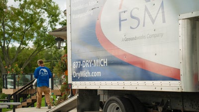 FSM employee working to install work in the ground