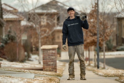 A Groundworks employee working to fix a home in the cold