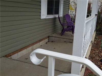Concrete slab sinking outside of residential home.
