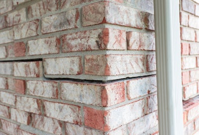 brick wall with horizontal cracks
