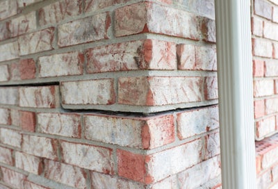Horizontal cracks in bricks.