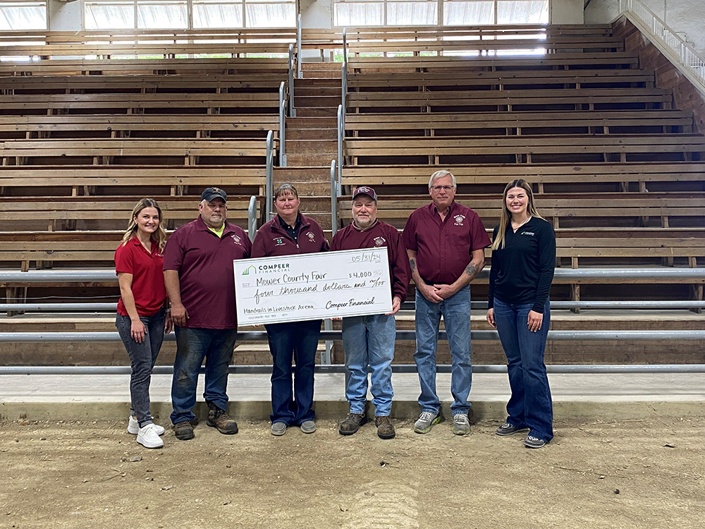Group photo of Compeer Financial representatives presenting a $4,000 check to the Mower County Fair for handrails in the livestock arena.