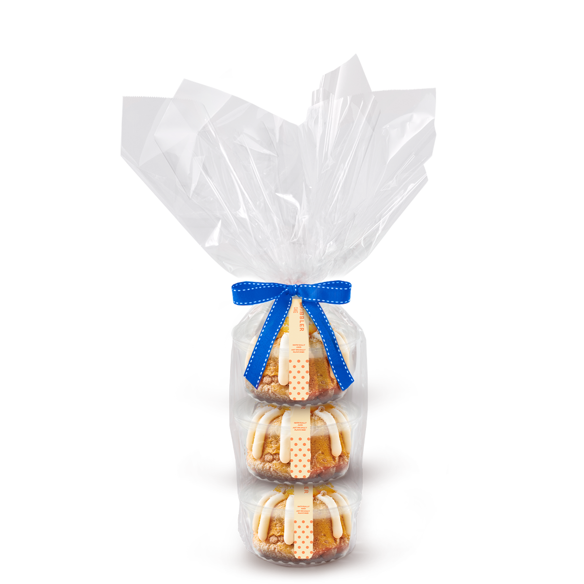 Three individually packaged Peach Cobbler Cake Bundtlet gift wrapped in cellophane with a blue stitched ribbon.