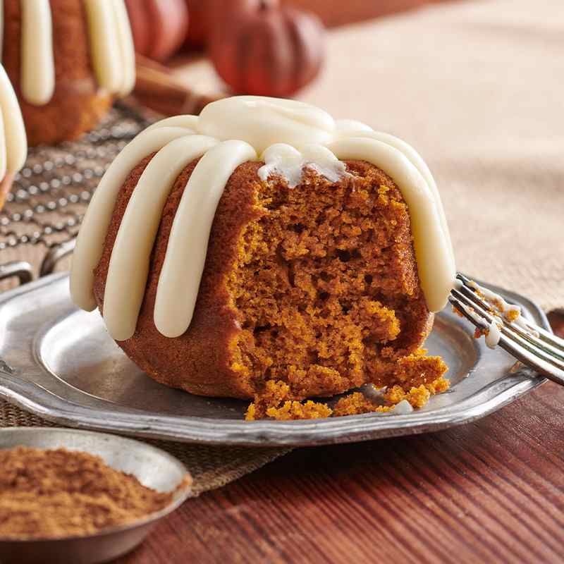 Individual Pumpkin Spice Bundtlet showing the middle of the personalized sized cake and signature frosting on top - Shop Bundtlets & Towers