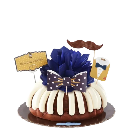 A bundt cake topped with bow and best dad a'round decorations.