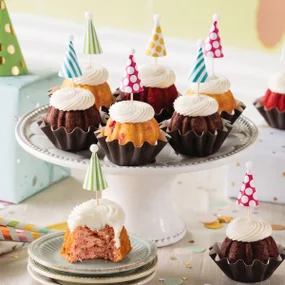 Assorted Bundtinis with celebration hat toppers