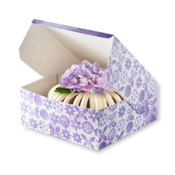 Bundt Cake with Flower in a Nothing Bundt Cakes bakery box.