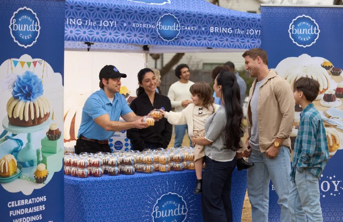Guests celebrating with Nothing Bundt Cakes at a 10 Million Bites of Joy fundraising event.