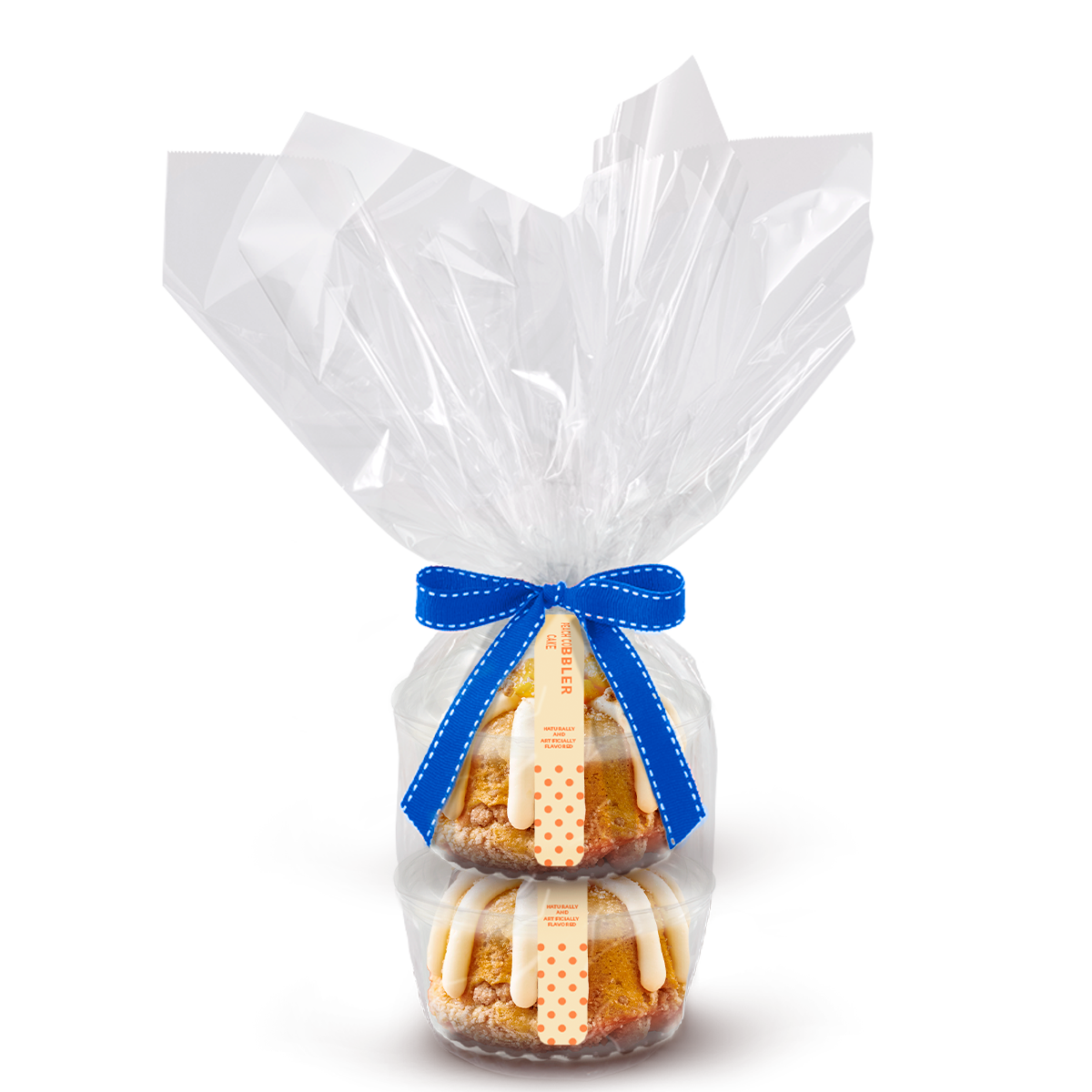 Two individually packaged Peach Cobbler Cake Bundtlet gift wrapped in cellophane with a blue stitched ribbon.