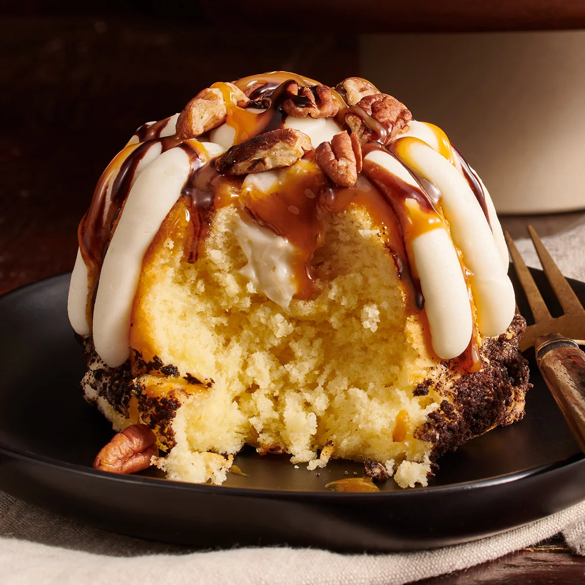 A personal Turtle Cheesecake Swirl Bundtlet crowned with our signature frosting.