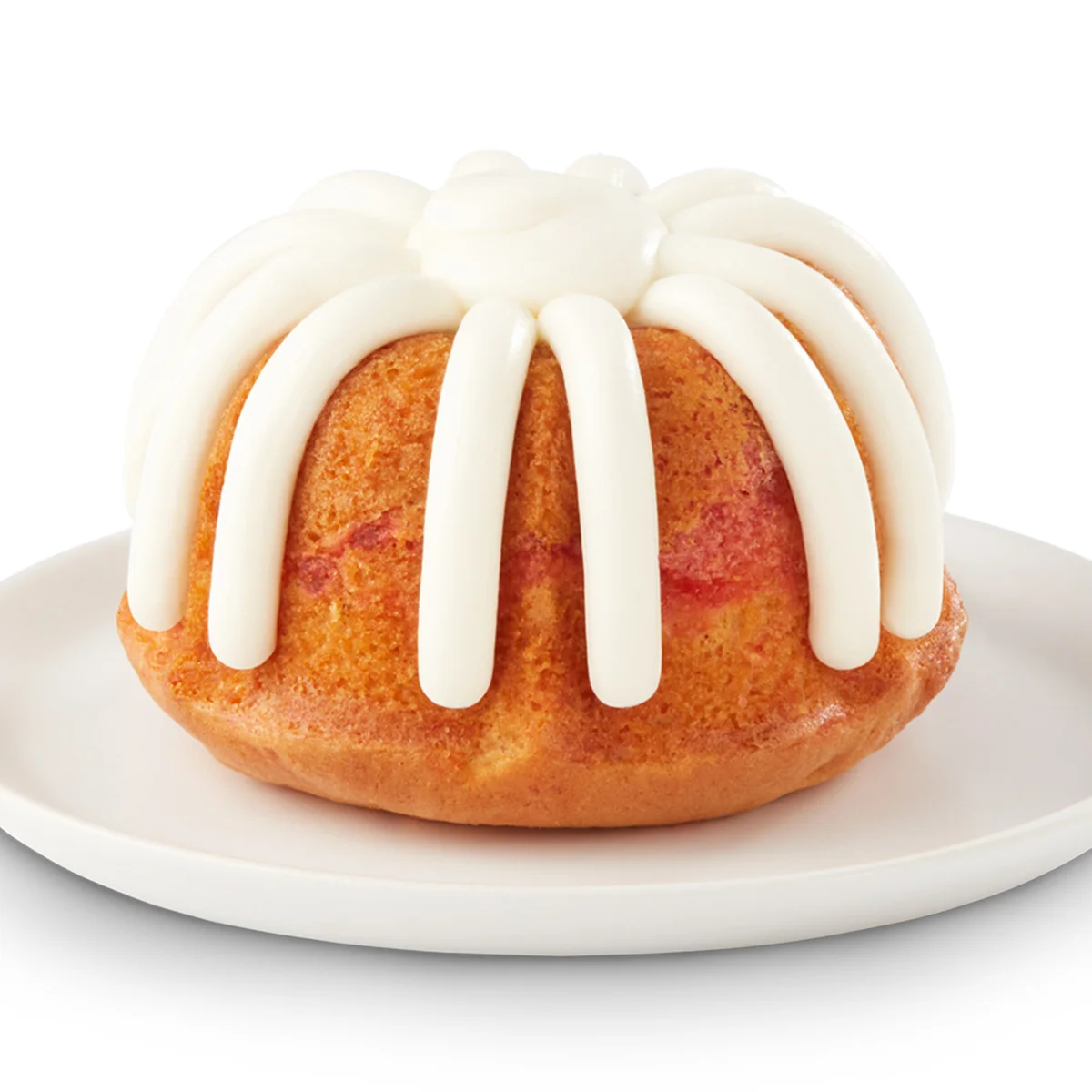 A personal Lemon Raspberry Bundtlet crowned with our signature frosting.