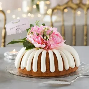 Yours, Mine, Ours Bundt Cake decorated with flower on top -- Shop Now.