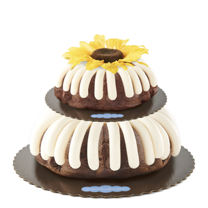 Tiered Cake decorated with a silk sunflower. -- Shop Now